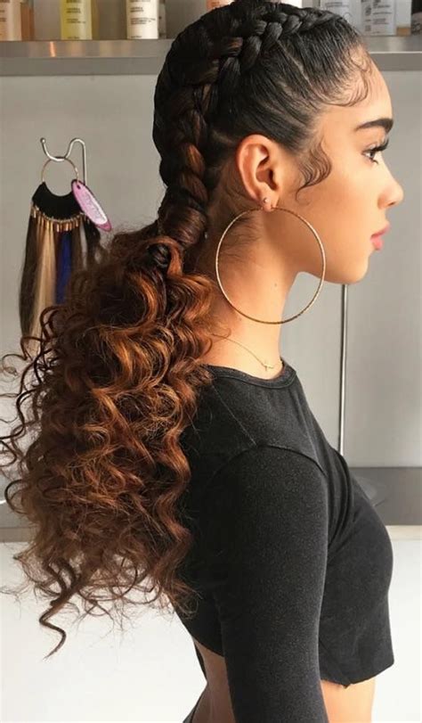 This look is created using hair extensions, which are seamlessly fed into the natural hair, removing bulk and making a natural appearance. . Two french braids with curly ends